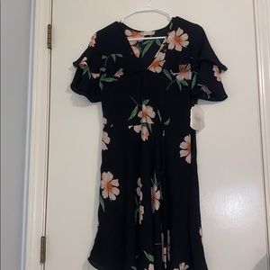 Short black dress with flowers on it